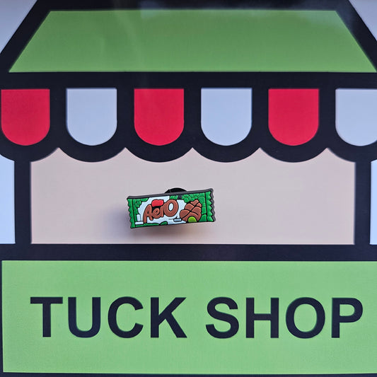 Aero chocolate bar croc charm on a 'Tuck Shop' sign with colorful awning