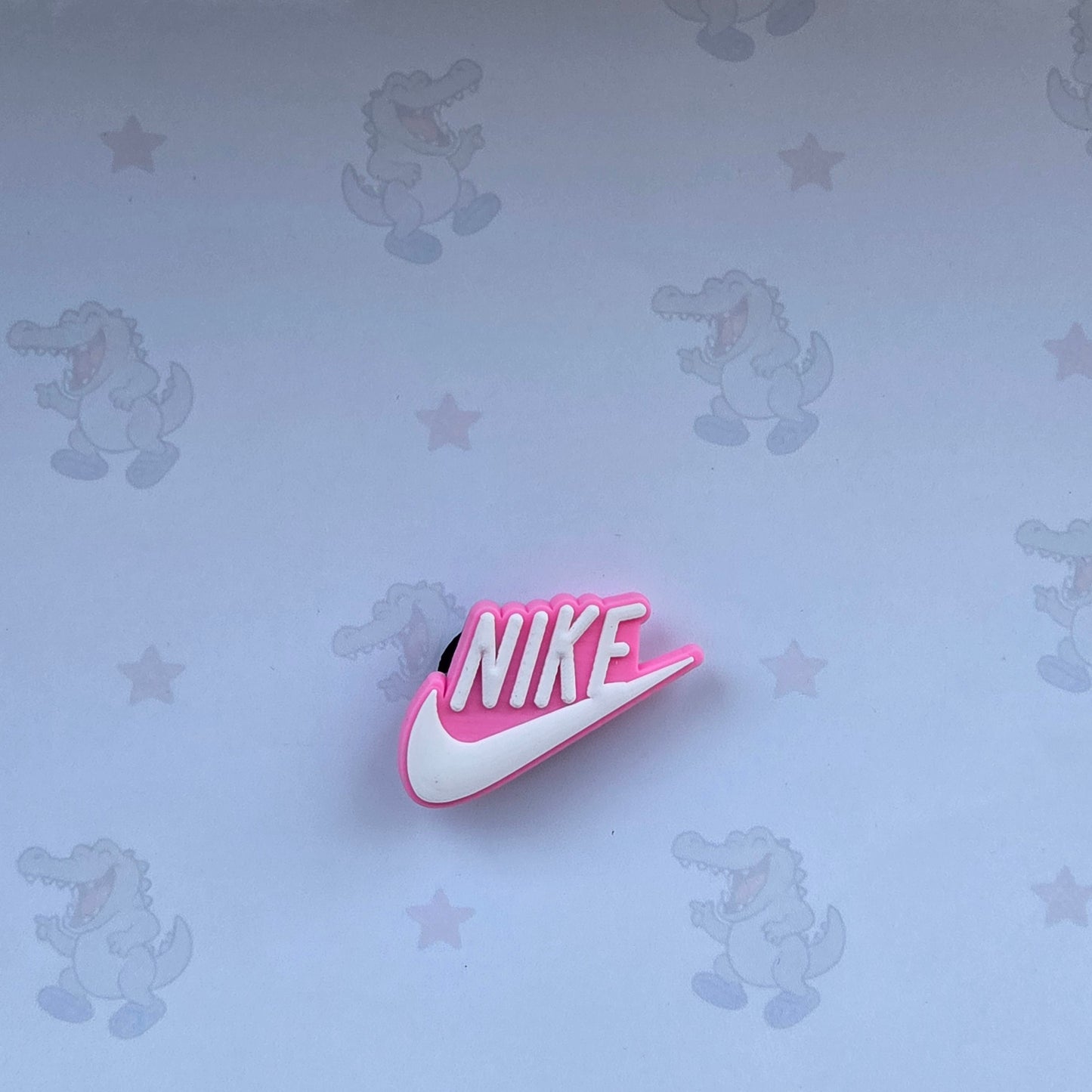 pink tick croc charm